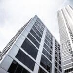 Close-up of non-combustible aluminum plates on high-rise facade, offering both safety and aesthetic appeal.