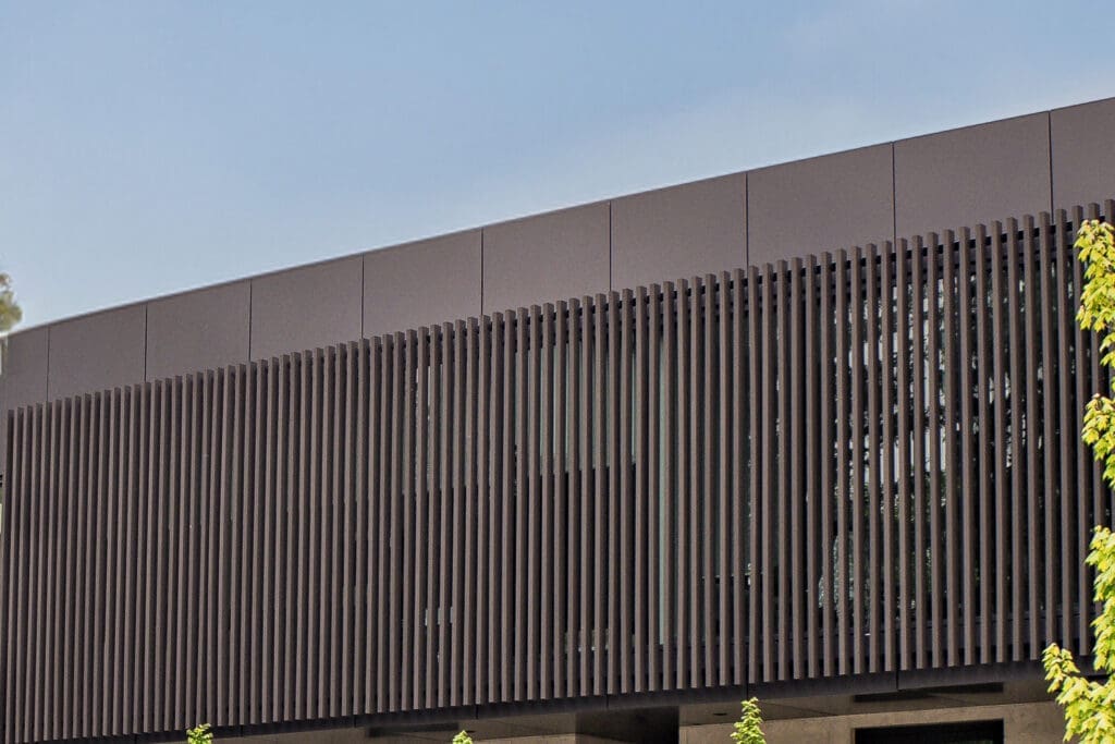 Close of house exterior siding with wood composite louver panel | NORTwood